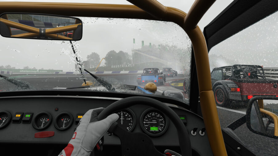 Cockpit view of a GT race car steering wheel and digital dashboard on track at sunset, symbolizing patch 0.7.1 update rollout