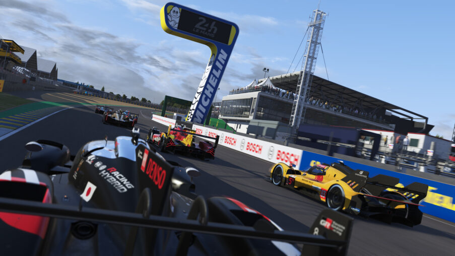 Le Mans Hypercar racing on the Circuit de la Sarthe at speed during a daytime endurance race session in Le Mans Ultimate