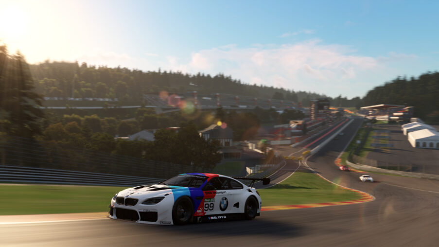 Automobilista 2 grid shot showing historic and endurance liveried cars from the DLC packs lined up on a circuit before a race start